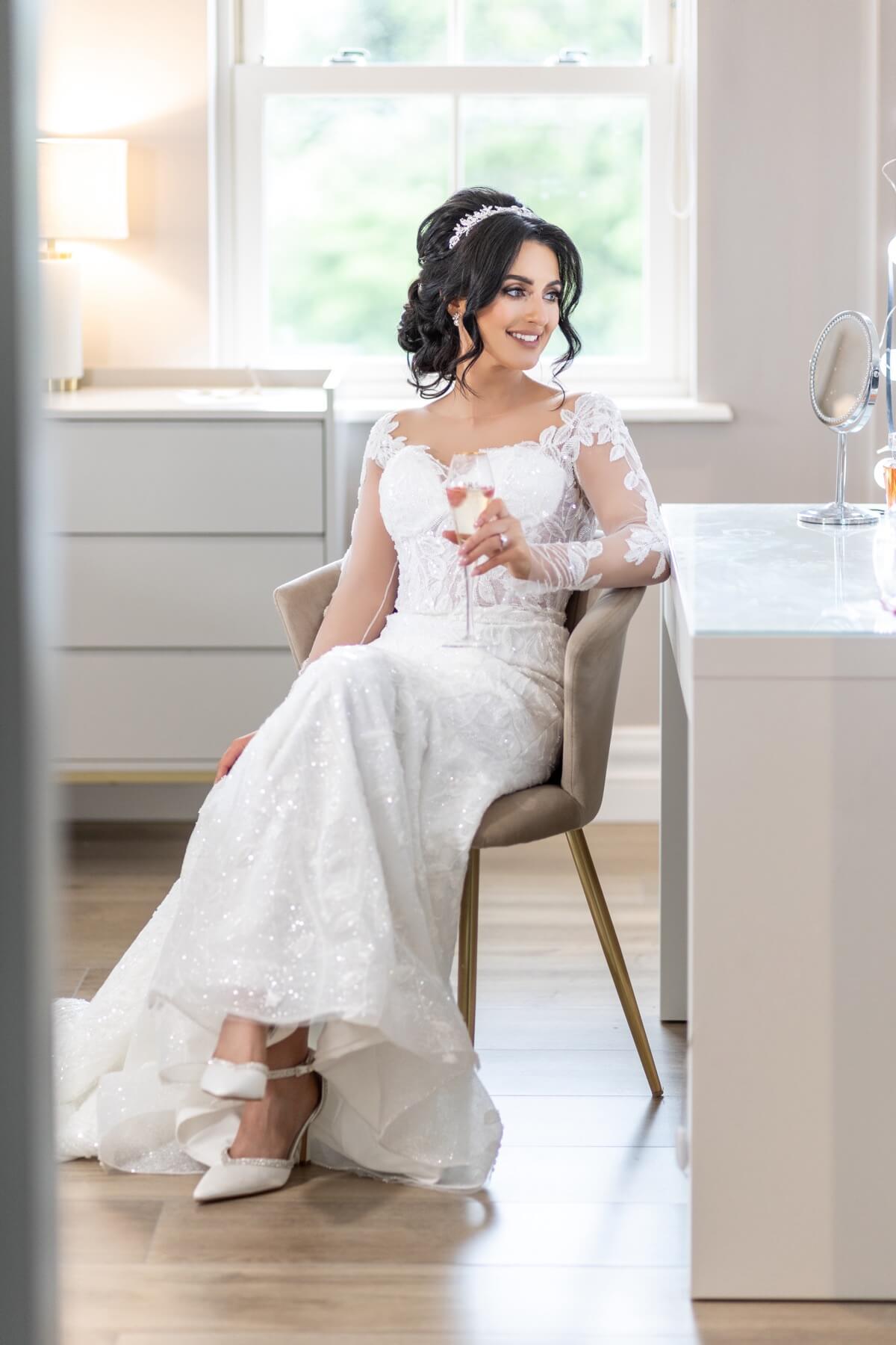 Bride getting ready by the window